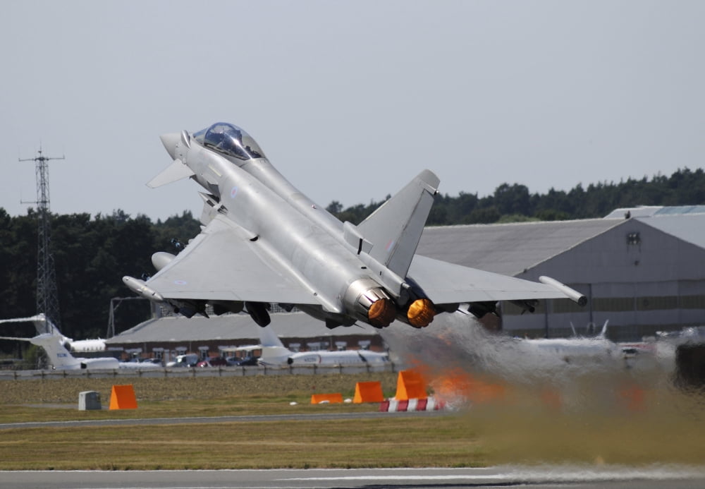 Eurofighter EF2000 Typhoon from the Royal Air Force at full afterburner during takeoff Canvas Art - Riccardo NiccoliStocktrek Images (17 x 12)