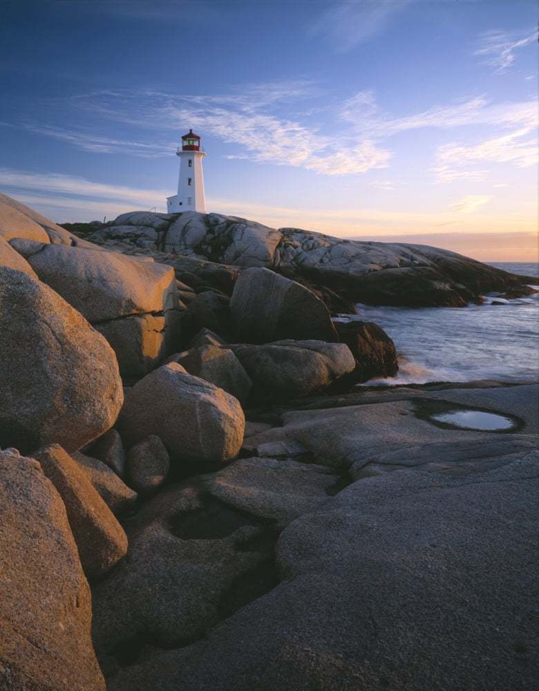 Evening light on Peggys Cove Lighthouse and the granite shoreline of Nova Scotia Canada Canvas Art - Panoramic Images (9 x 27)
