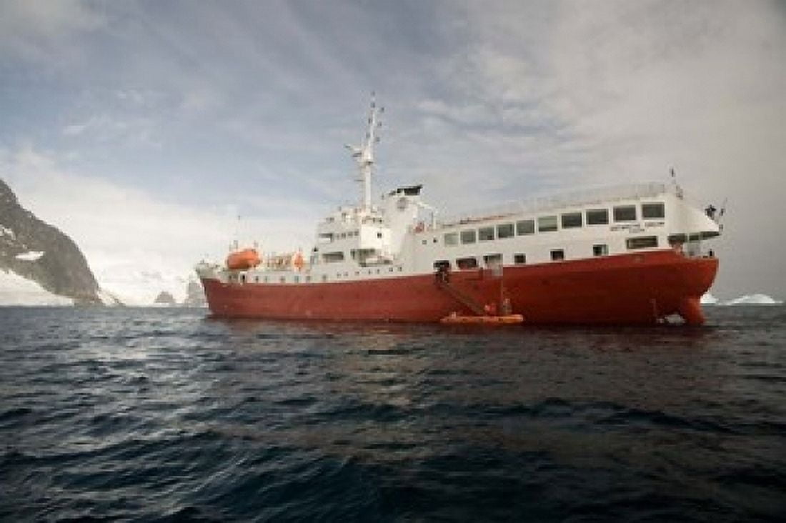 Expedition ship and zodiac Pleneau Island Antarctica Canvas Art - Dave Bartruff DanitaDelimont (17 x 11)