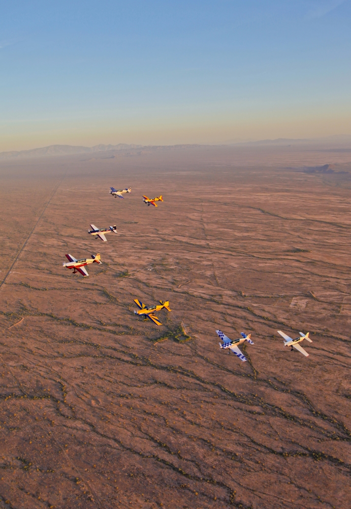 Extra 300 aerobatic aircraft fly in formation over Mesa Arizona Canvas Art - Scott GermainStocktrek Images (12 x 18)