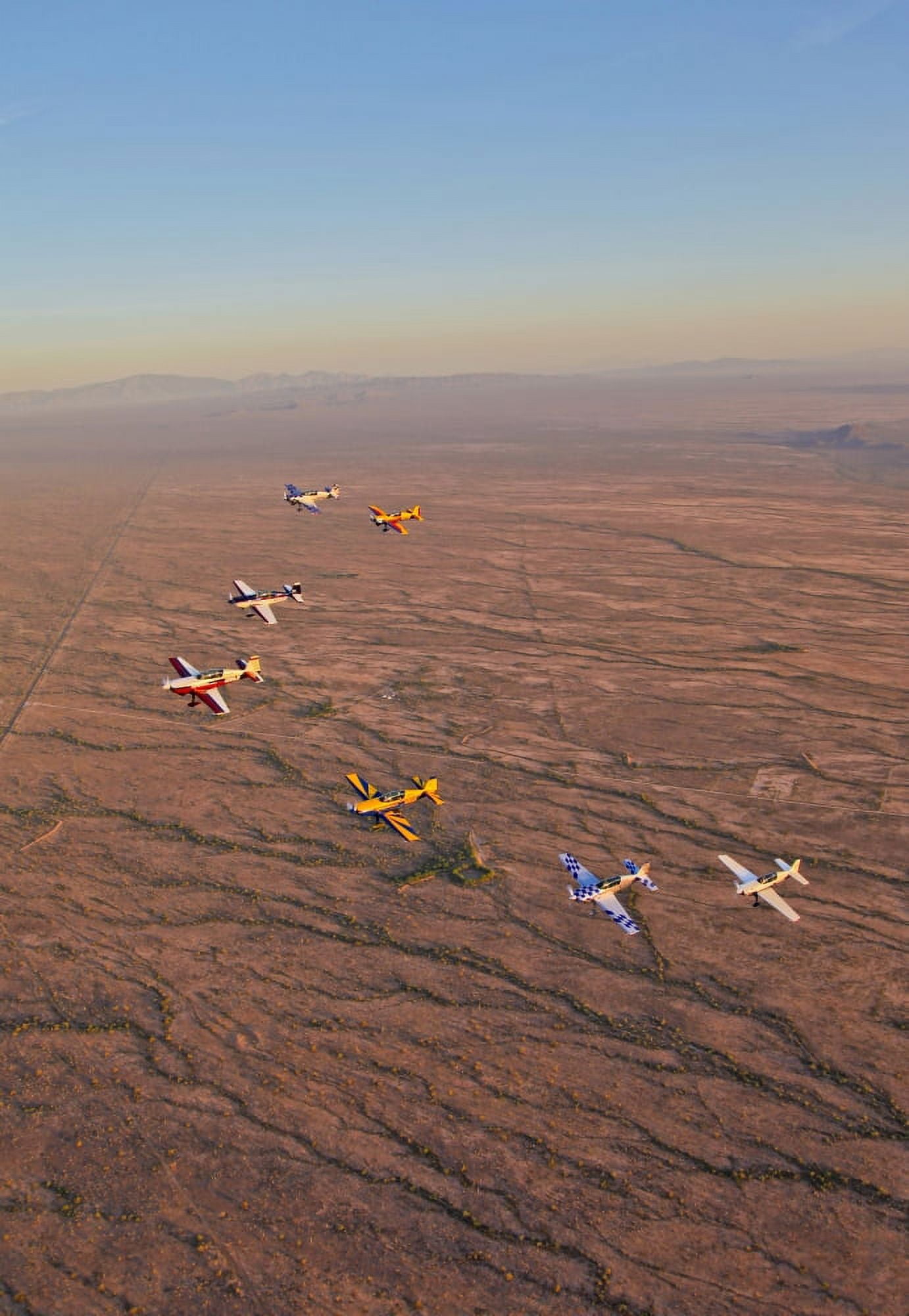 Extra 300 aerobatic aircraft fly in formation over Mesa Arizona Canvas Art - Scott GermainStocktrek Images (24 x 35)