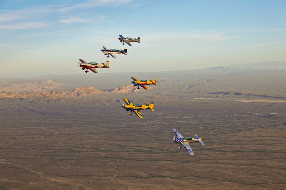 Extra 300 aerobatic aircraft fly in formation over Mesa Arizona Canvas Art - Scott GermainStocktrek Images (35 x 23)