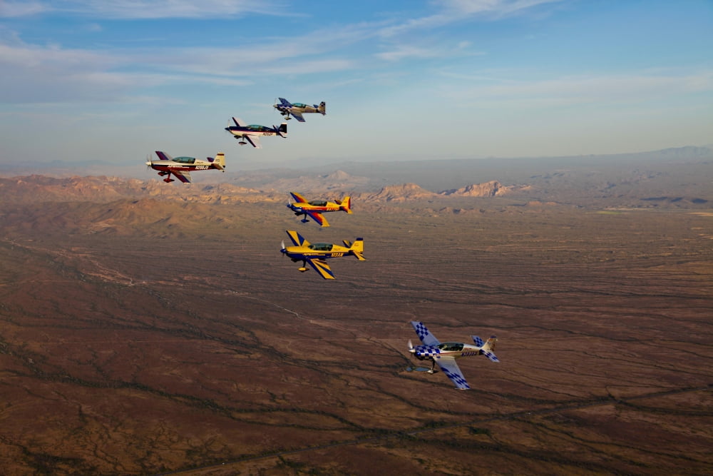 Extra 300 aerobatic aircraft fly in formation over Mesa Arizona Canvas Art - Scott GermainStocktrek Images (35 x 23)