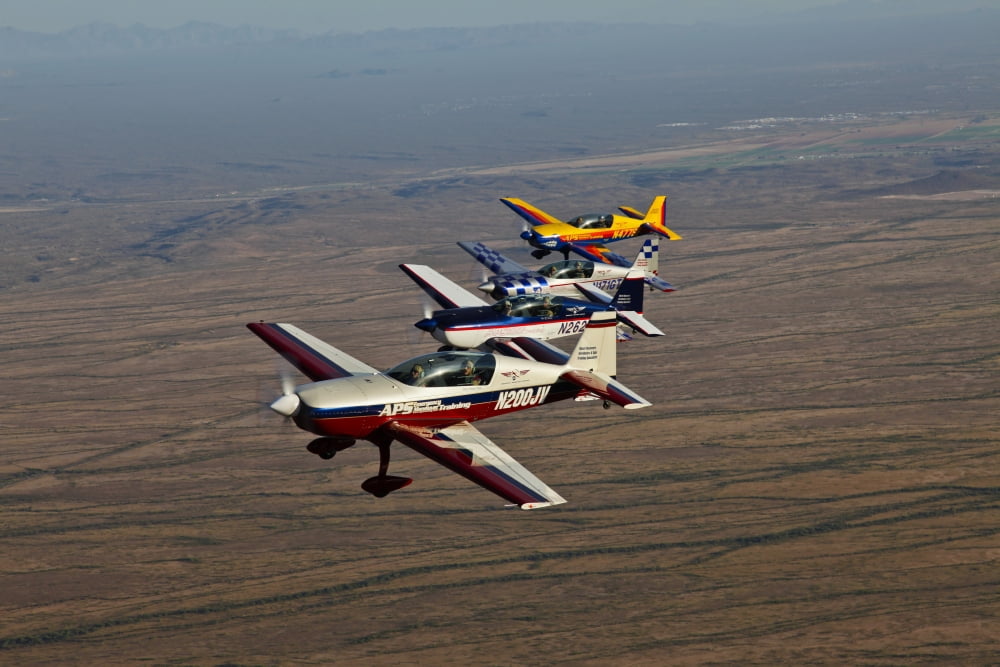 Extra 300 aerobatic aircraft fly in formation over Mesa Arizona Canvas Art - Scott GermainStocktrek Images (35 x 23)