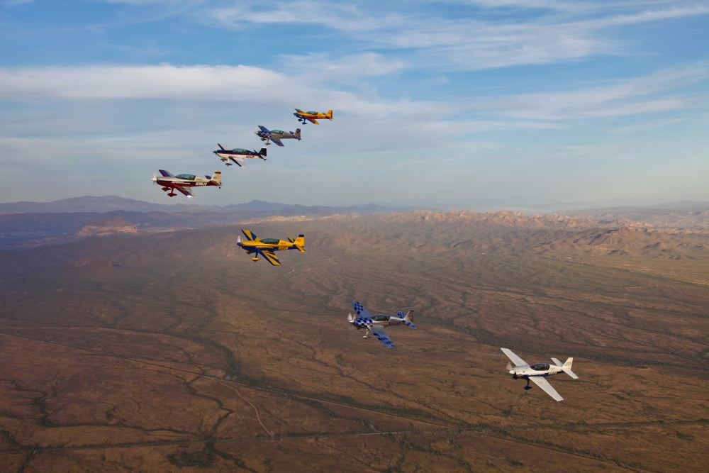 Extra 300 aerobatic aircraft fly in formation over Mesa Arizona Canvas Art - Scott GermainStocktrek Images (35 x 23)