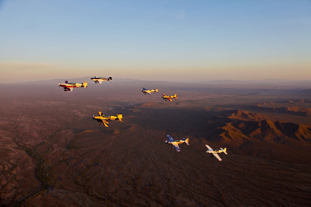 Extra 300 aerobatic aircraft fly in formation over Mesa Arizona Canvas Art - Scott GermainStocktrek Images (35 x 23)