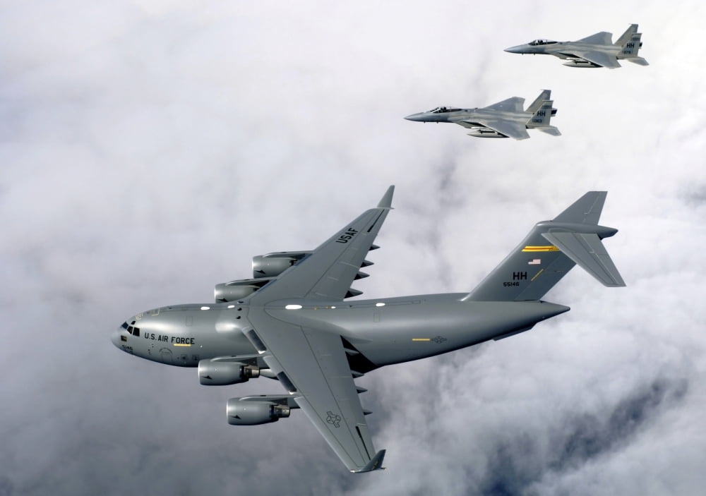 F-15B Eagles escort the first Hawaii-based C-17 Globemaster III to its home Canvas Art - Stocktrek Images (33 x 23)
