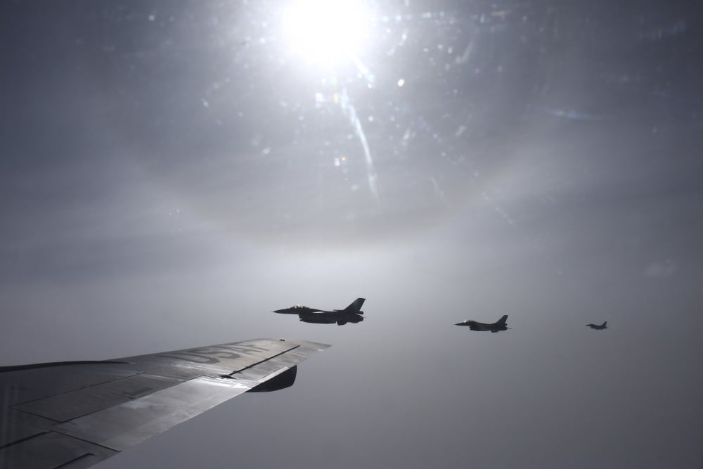 F-16 Fighting Falcon fighters over the wing of a KC-135 Stratotanker Canvas Art - Daniel KarlssonStocktrek Images (35 x 24)