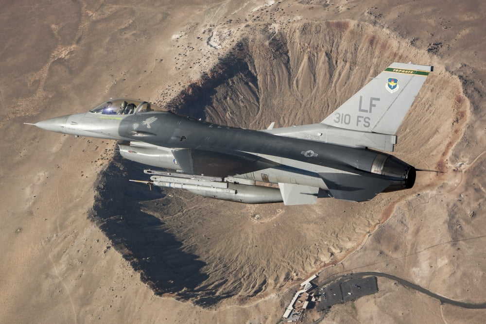 F-16C Fighting Falcon flying above Arizonas Meteor Crater Canvas Art - Erik RoelofsStocktrek Images (35 x 23)