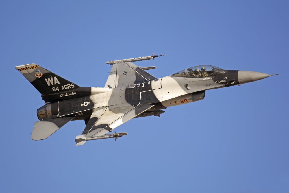 F-16C Fighting Falcon flying over Fallon Nevada Canvas Art - Phil WallickStocktrek Images (34 x 23)