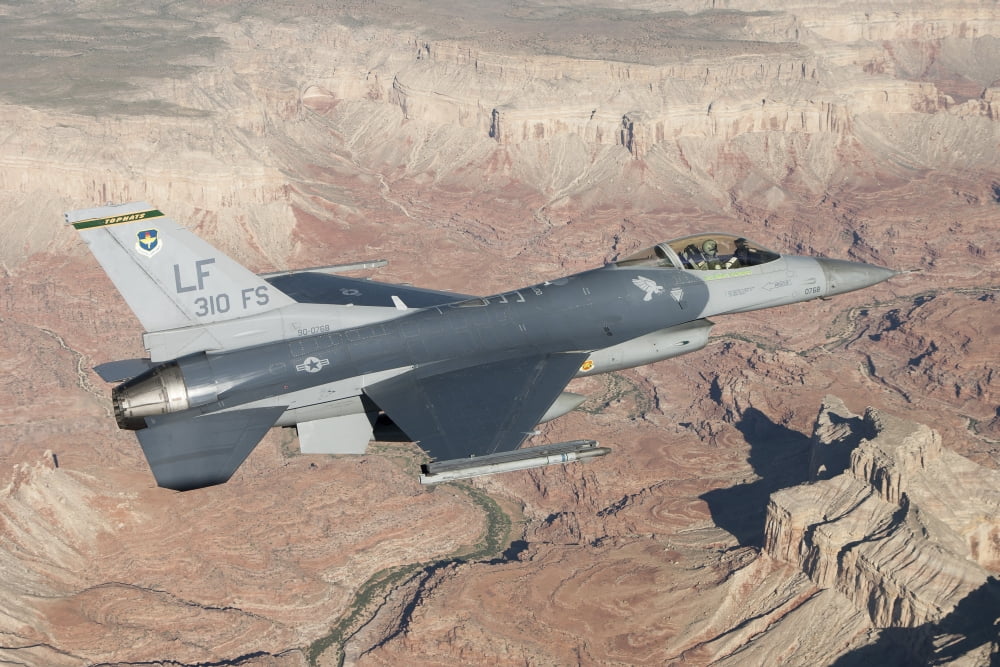 F-16C Fighting Falcon flying over the Grand Canyon Arizona Canvas Art - Erik RoelofsStocktrek Images (35 x 23)