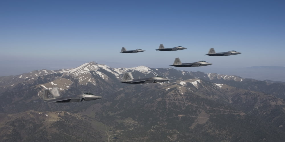 F-22 Raptors fly in formation during a training mission over New Mexico Canvas Art - HIGH-G ProductionsStocktrek Images (20 x 10)