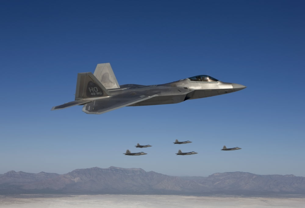 F-22 Raptors fly in formation during a training mission over New Mexico Canvas Art - HIGH-G ProductionsStocktrek Images (35 x 24)