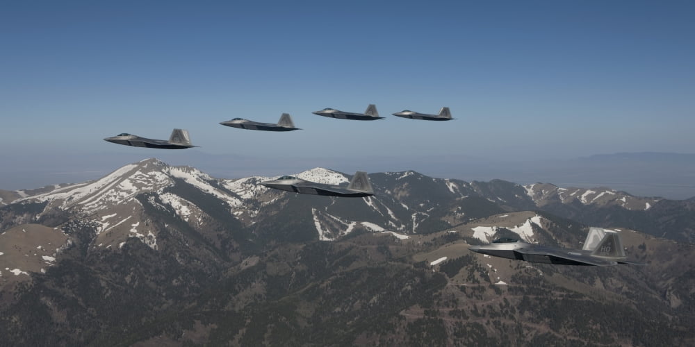 F-22 Raptors fly in formation during a training mission over New Mexico Canvas Art - HIGH-G ProductionsStocktrek Images (40 x 20)