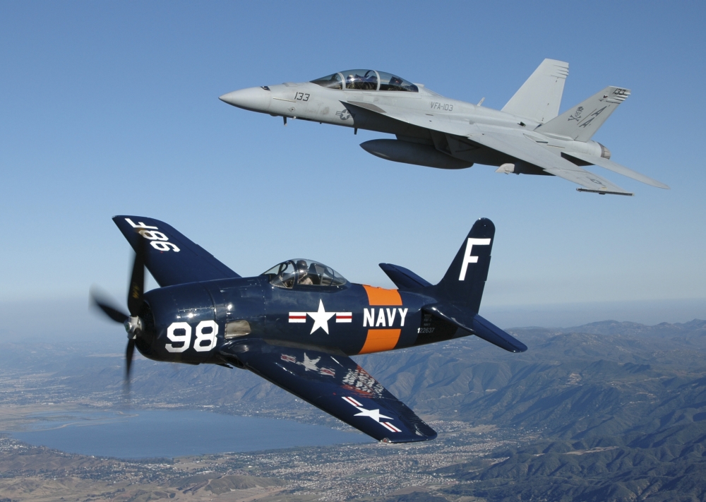 FA-18 Hornet and F8F Bearcat flying over Chino California Canvas Art - Phil WallickStocktrek Images (17 x 12)
