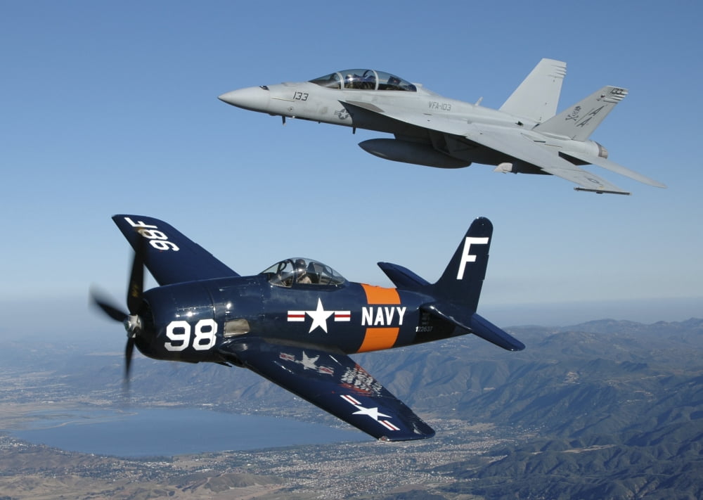FA-18 Hornet and F8F Bearcat flying over Chino California Canvas Art - Phil WallickStocktrek Images (34 x 24)