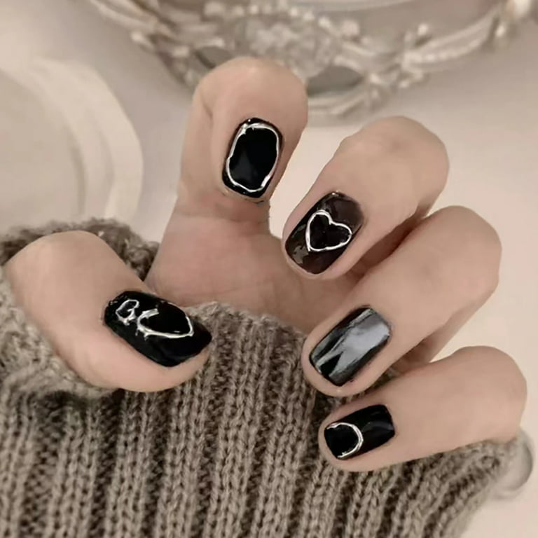 black nails with heart design