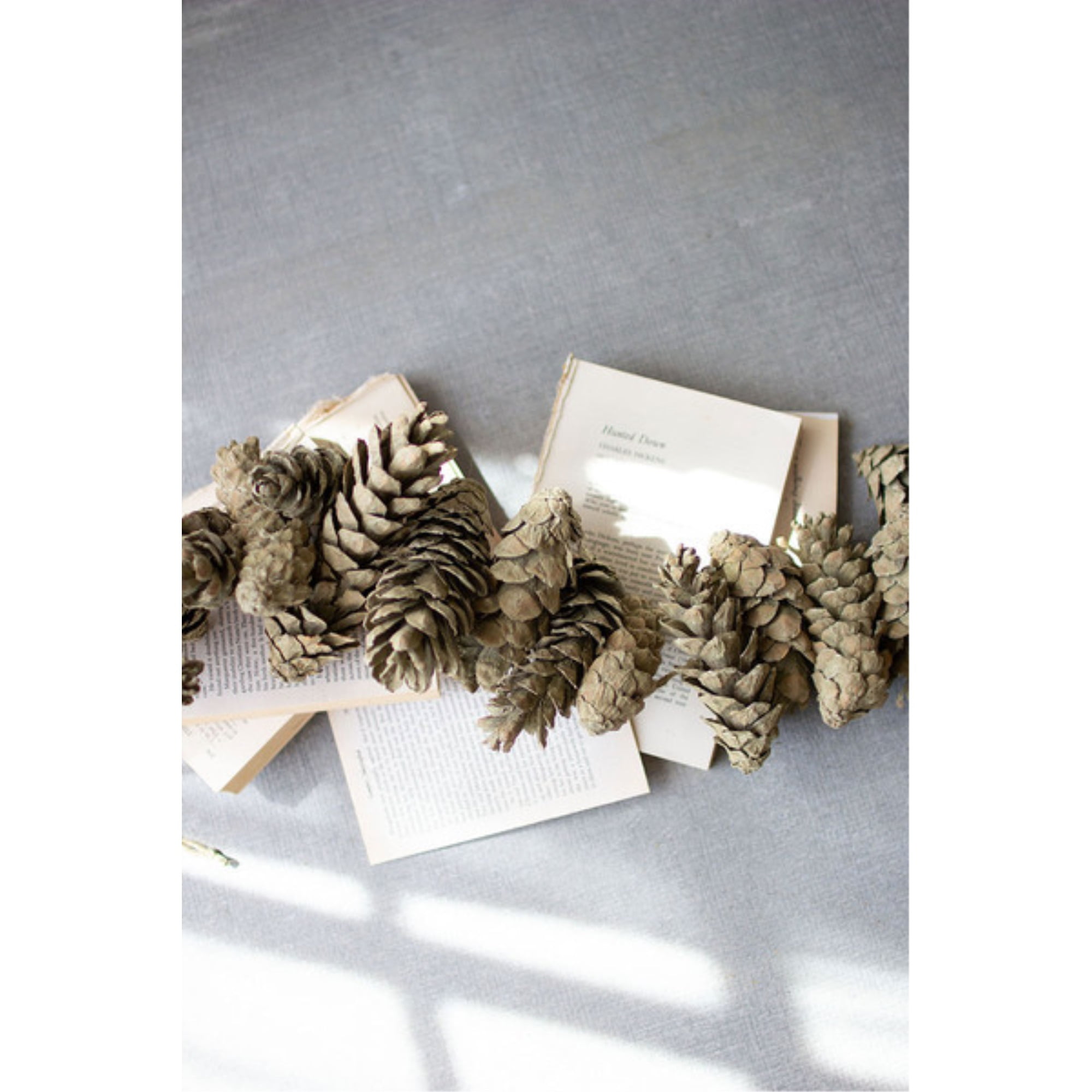 Premium Photo  Gift wrapping in brown kraft paper. gift box with craft  paper, scissors, pine cones and a skein of twine.