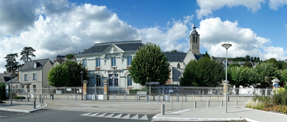 Facade of Church Of Our Lady Of The Assumption and School against cloudy sky Vouvray Indre-et-Loire Loire Valley France Canvas Art - Panoramic Images (6 x 15)
