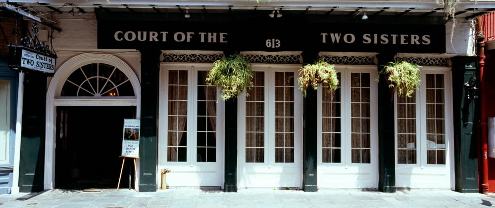 Facade of a restaurant Court of Two Sisters restaurant New Orleans Louisiana USA Canvas Art - Panoramic Images (36 x 12)