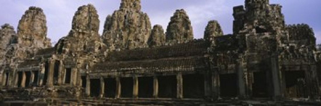 Facade of an old temple Angkor Wat Siem Reap Cambodia Canvas Art - Panoramic Images (18 x 6)