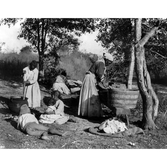 Family Wash Day, C1900./Nafrican-American Woman Doing Laundry With A Washboard And Tub, As A Girl Stirs Pot With 3 Other Children On The Ground Watching, C1900. Poster Print by (24 x 36)