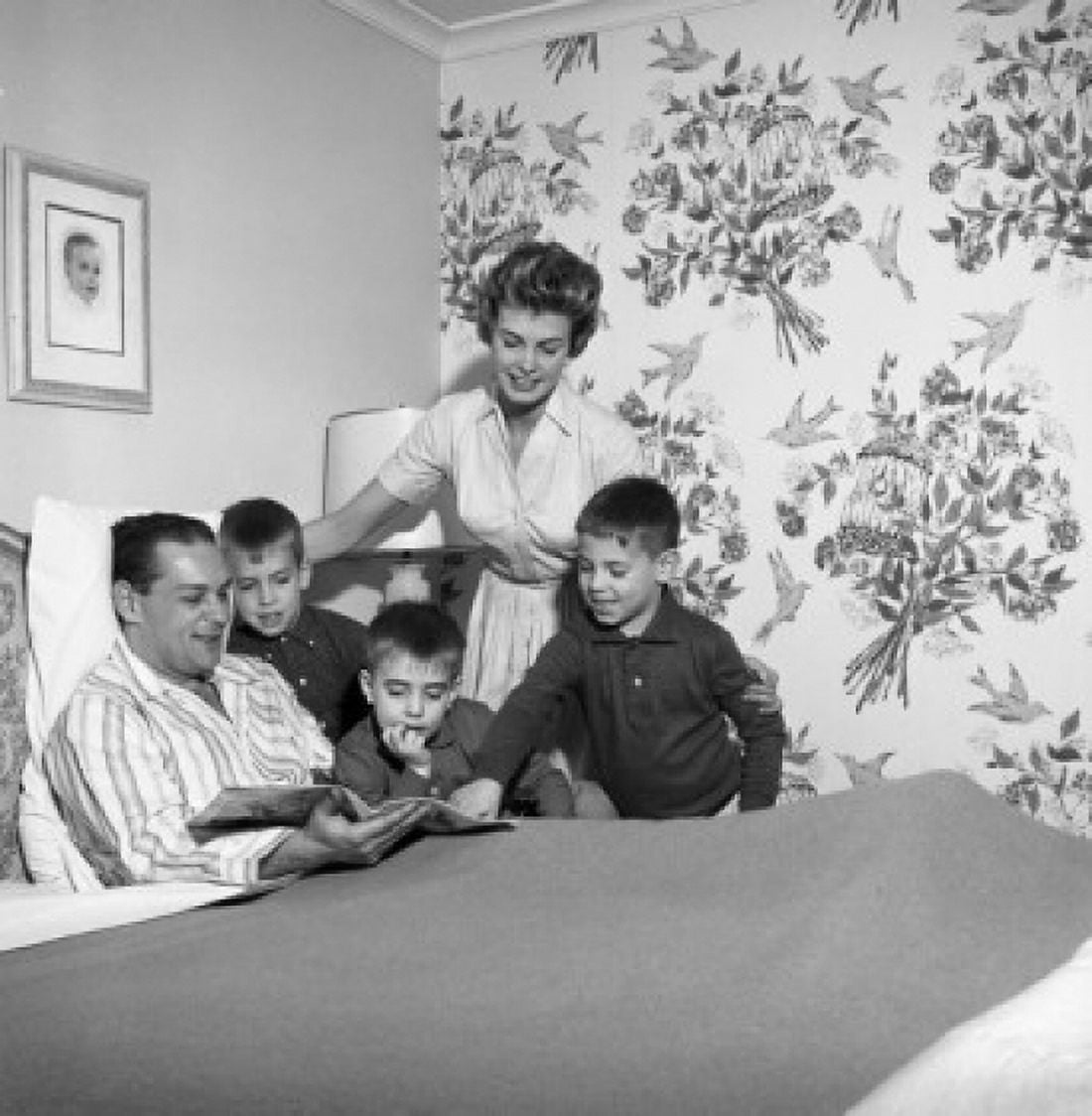 Family around ill fathers bed Canvas Art - (18 x 24)