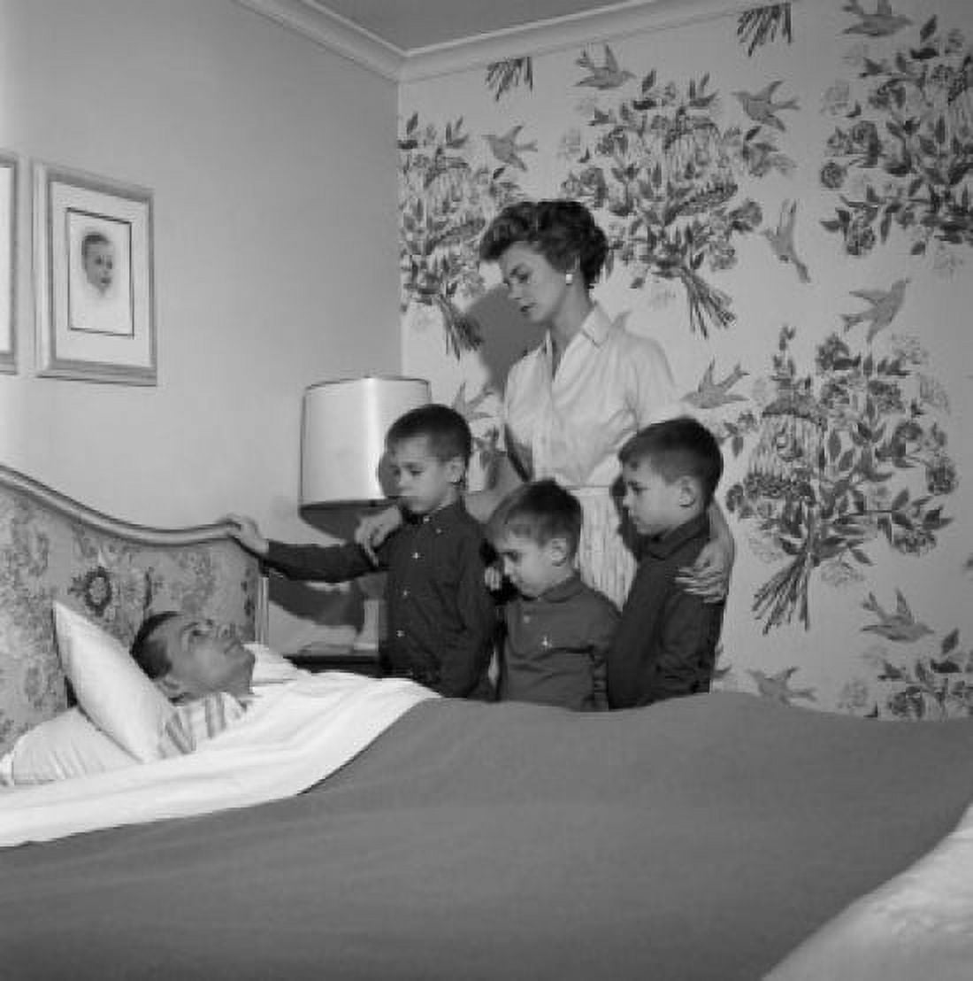 Family around ill fathers bed Canvas Art - (24 x 36)