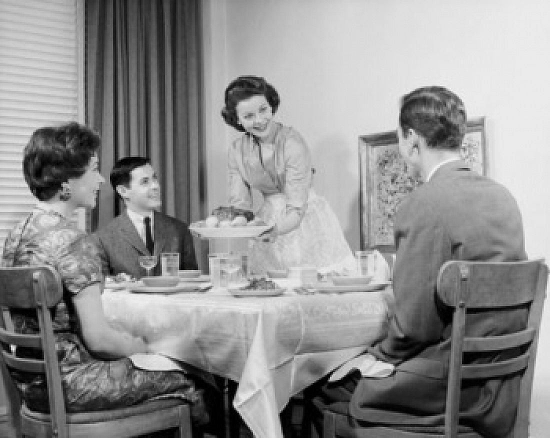 Family eating dinner together Canvas Art - (18 x 24)