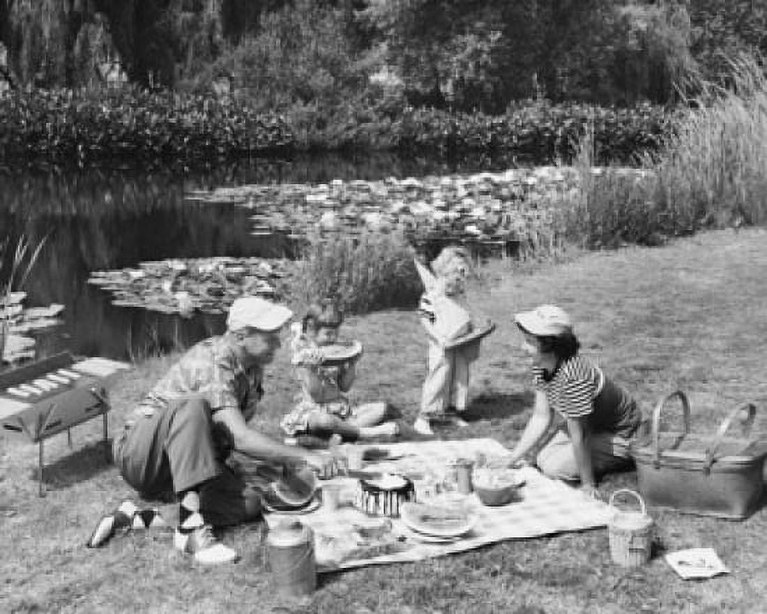 Family having a picnic near a pond Canvas Art - (24 x 36)
