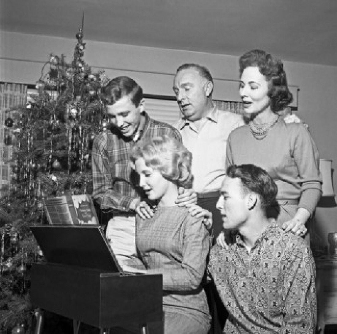 Family playing and singing Christmas carols Canvas Art - (24 x 36)
