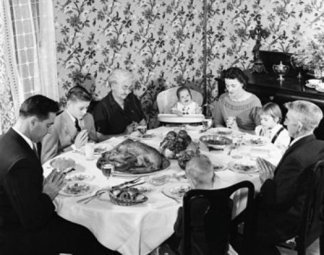 Family praying at dining table on Thanksgiving Day Canvas Art -  (24 x 36)