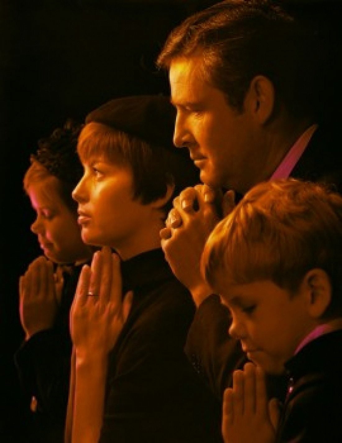 Family praying in a church Canvas Art - (24 x 36)