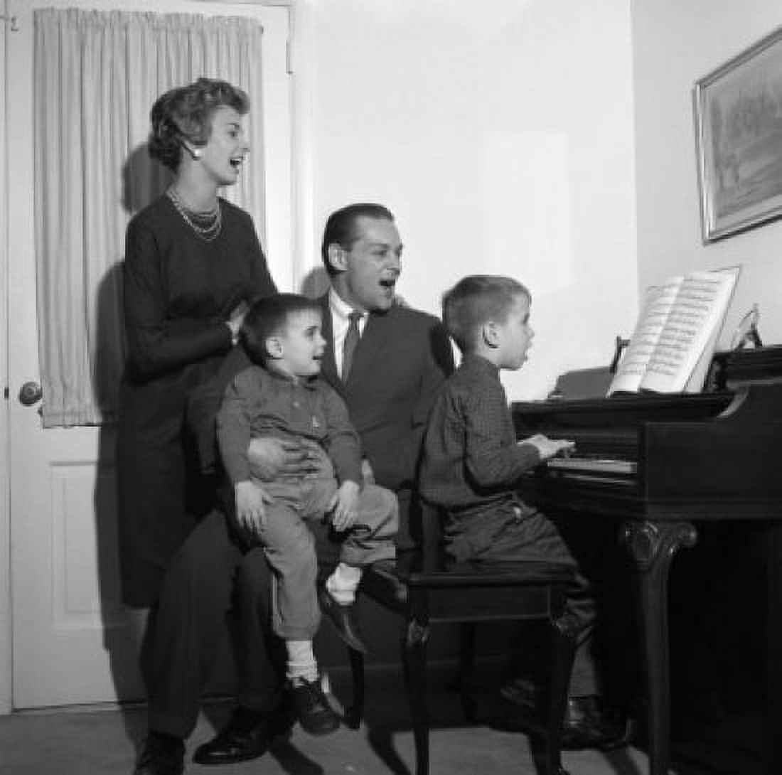 Family signing by with boy playing piano Canvas Art - (24 x 36)