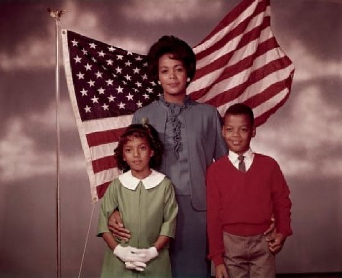 Family standing in front of an American flag Canvas Art -  (24 x 36)