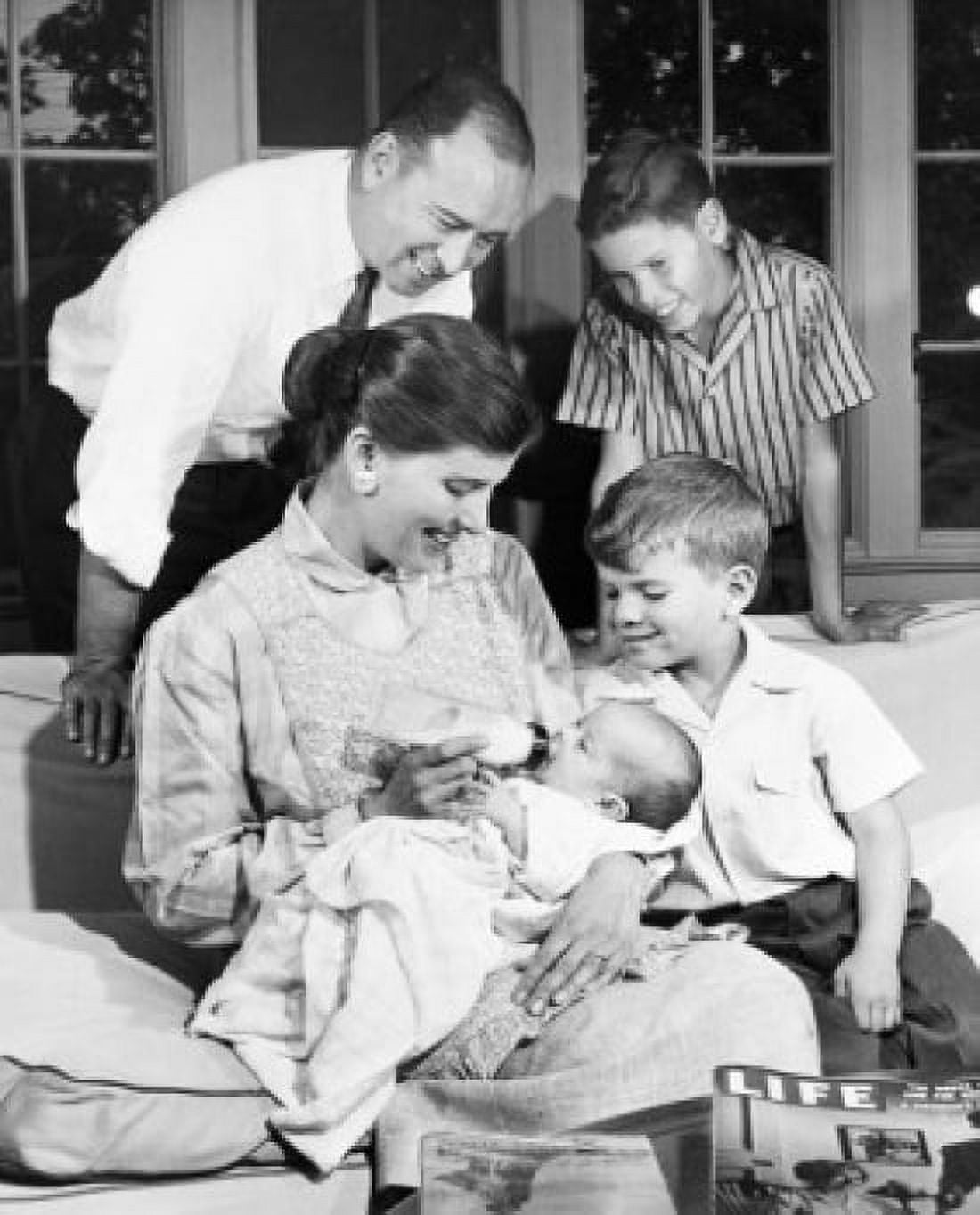 Family with boys in living room Canvas Art - (18 x 24)