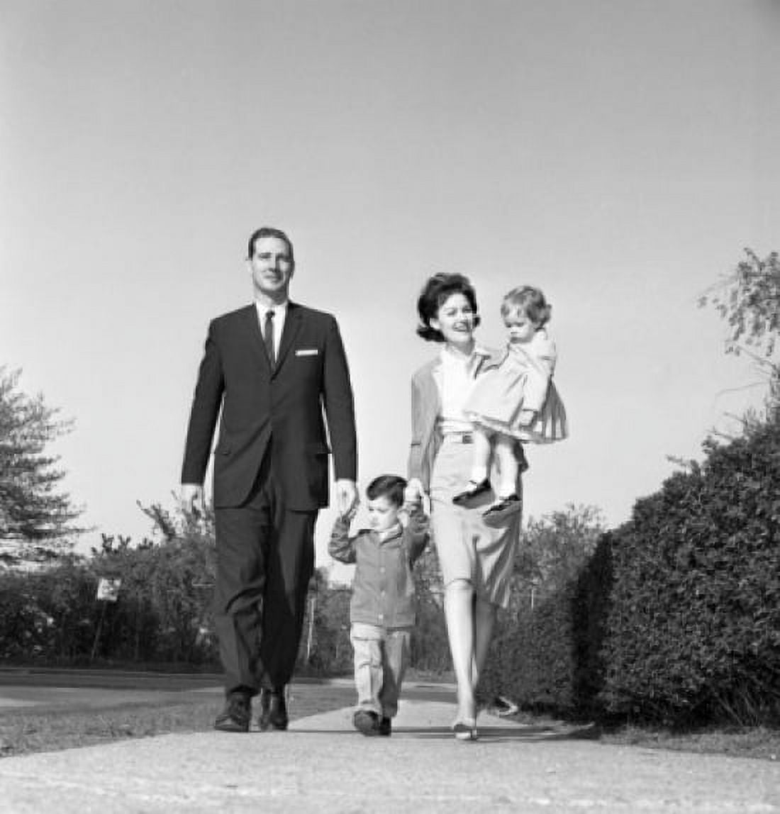 Family with daughter and son walking in park Canvas Art - (24 x 36)