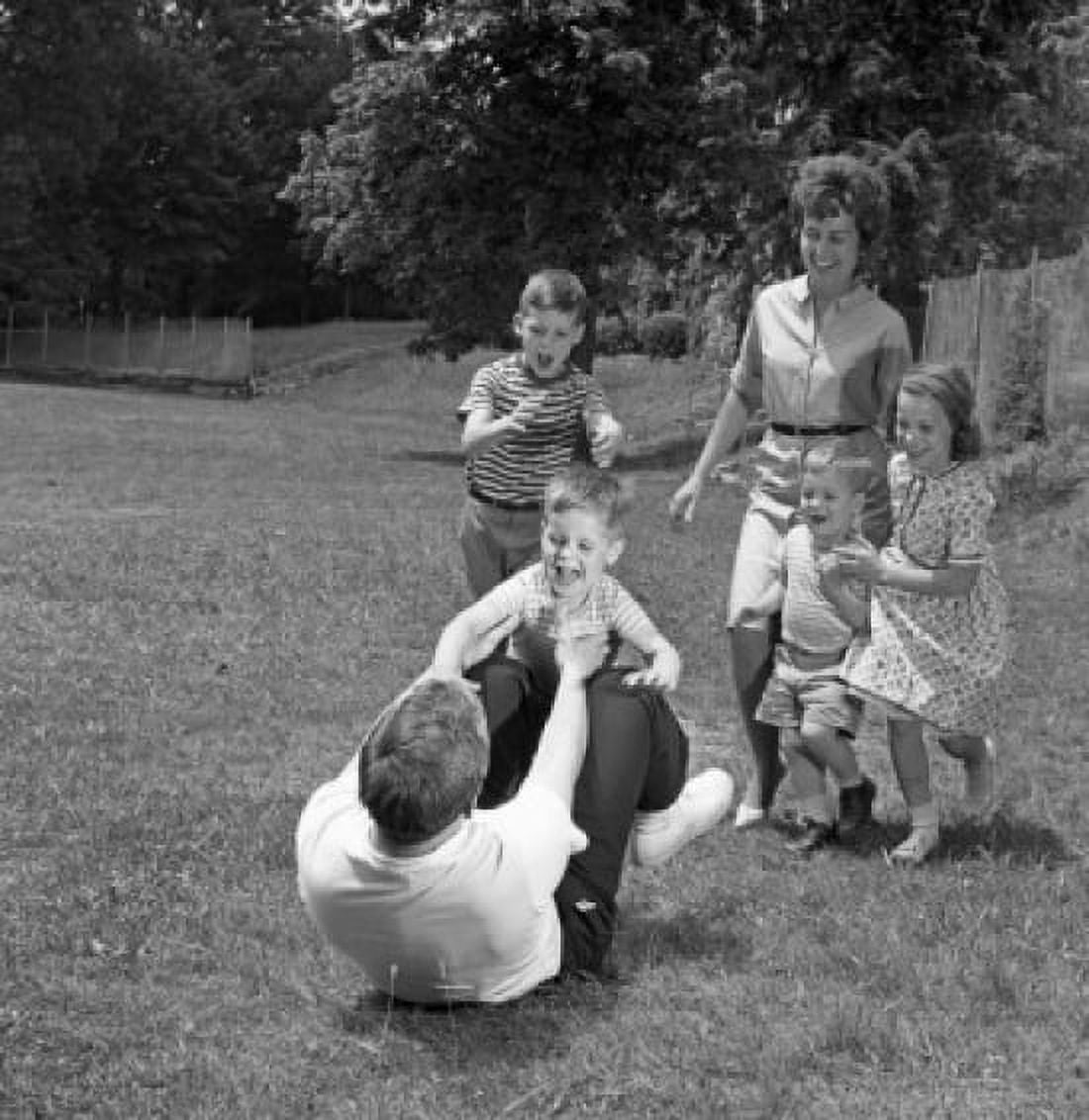 Family with four children playing in backyard Canvas Art - (18 x 24)
