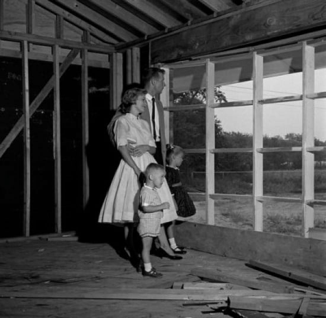 Family with son and daughter contemplating future home Canvas Art - (18 x 24)
