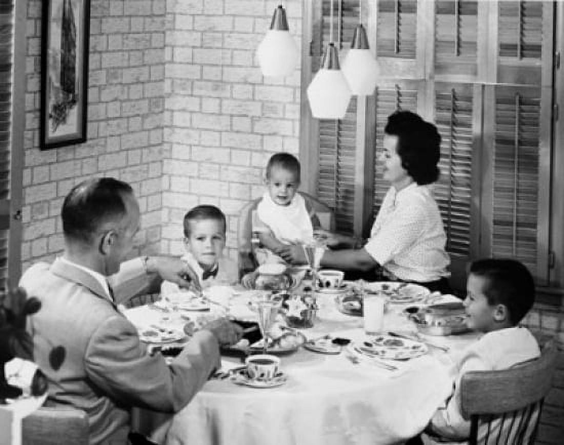 Family with three children eating together Canvas Art - (18 x 24)