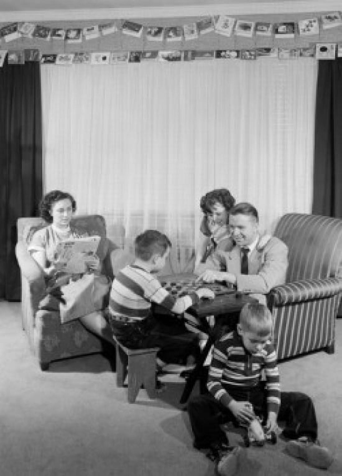 Family with three children in living room Canvas Art - (18 x 24)