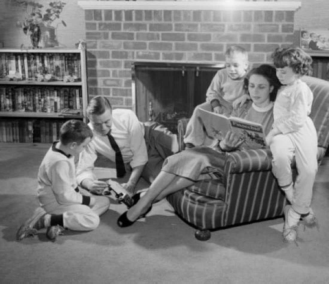 Family with tree children in living room Canvas Art - (24 x 36)