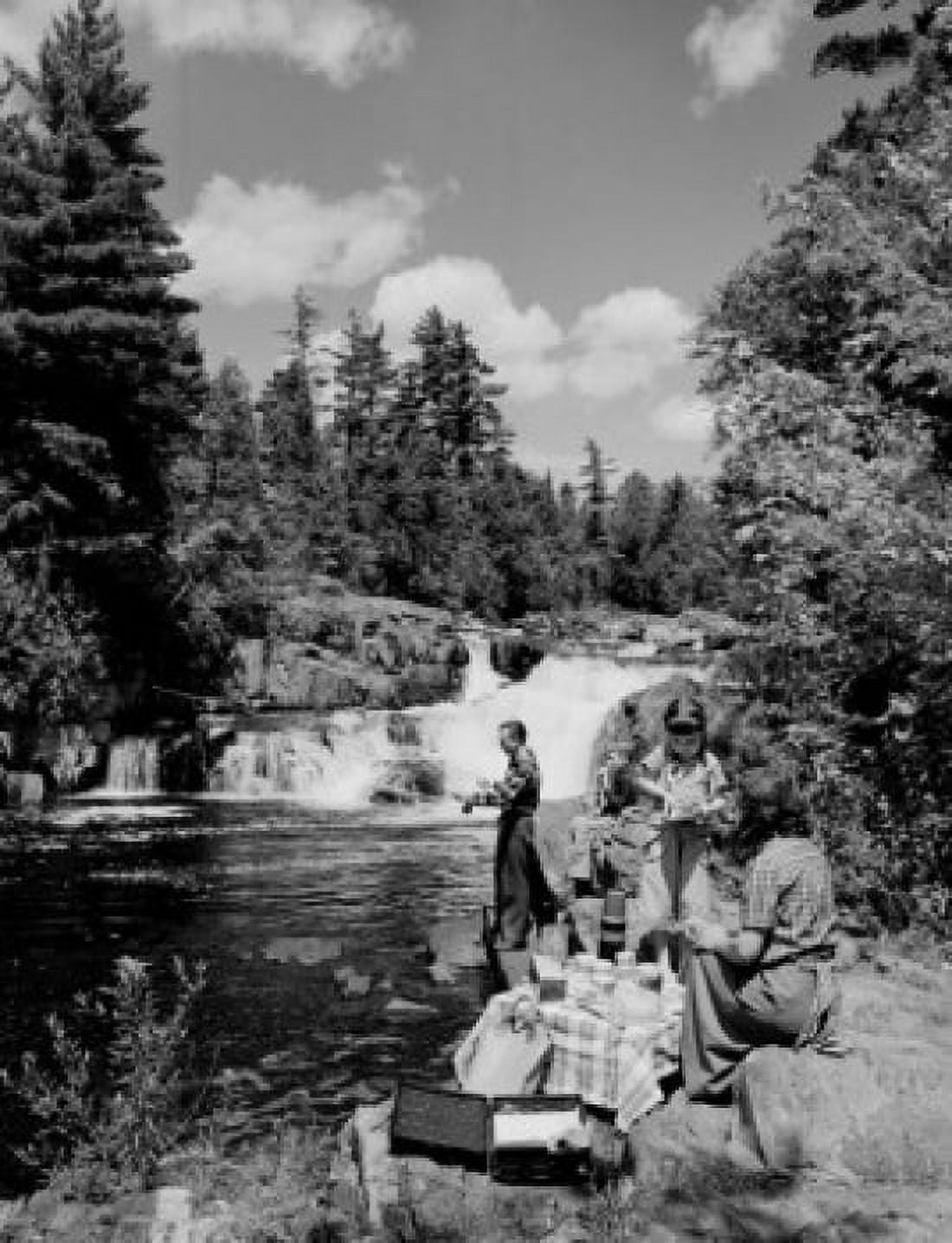 Family with two children having picnic by river Canvas Art - (18 x 24)