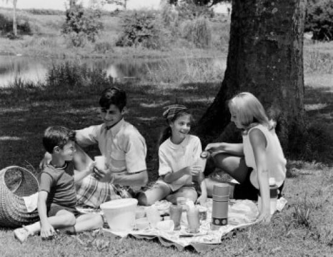 Family with two children having picnic in park Canvas Art - (18 x 24)