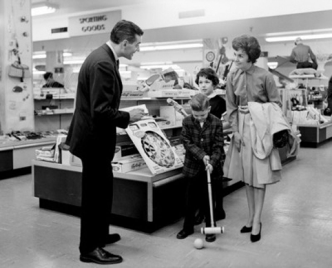 Family with two children in toy shop Canvas Art - (24 x 36)