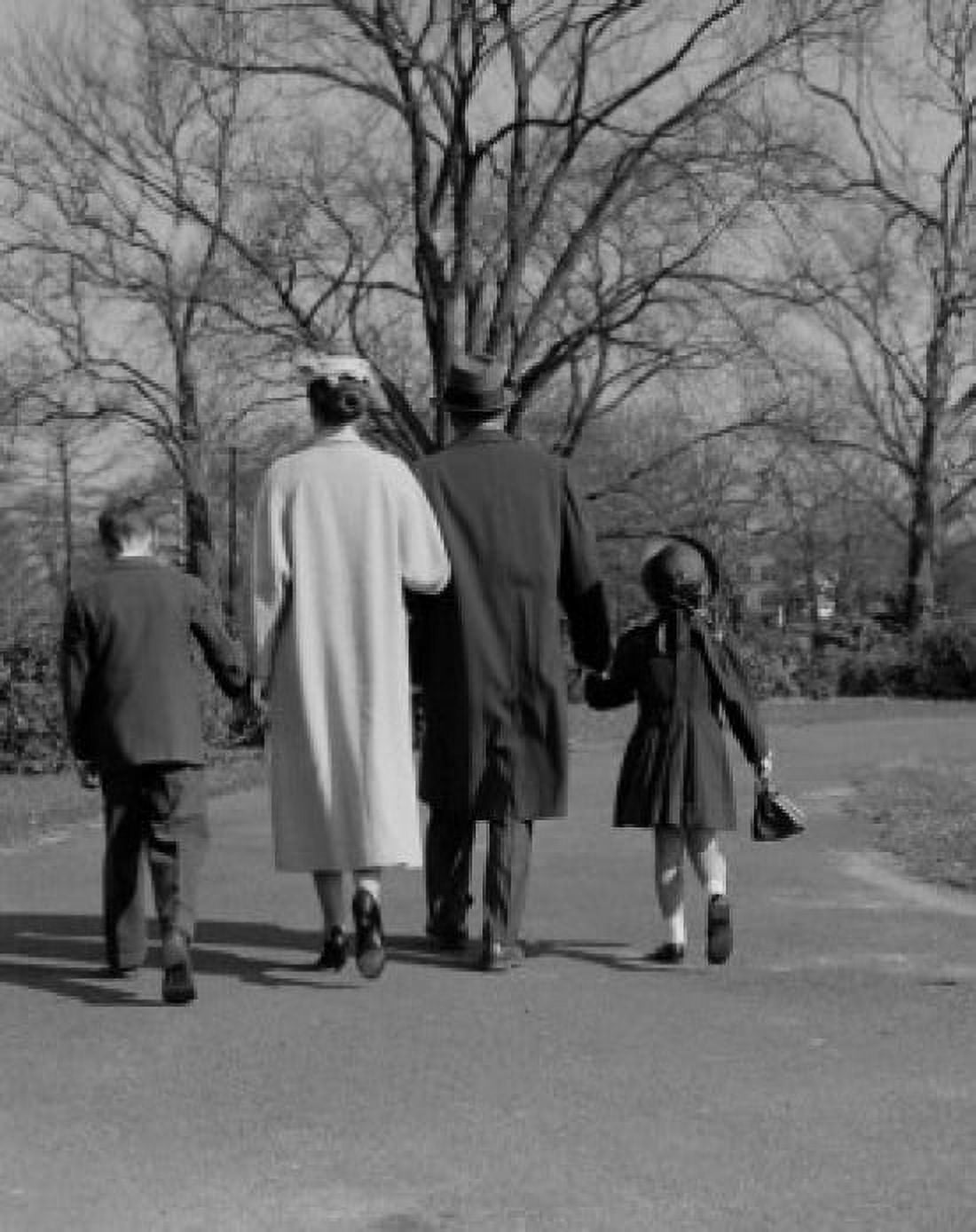 Family with two children walking in park Canvas Art - (24 x 36)