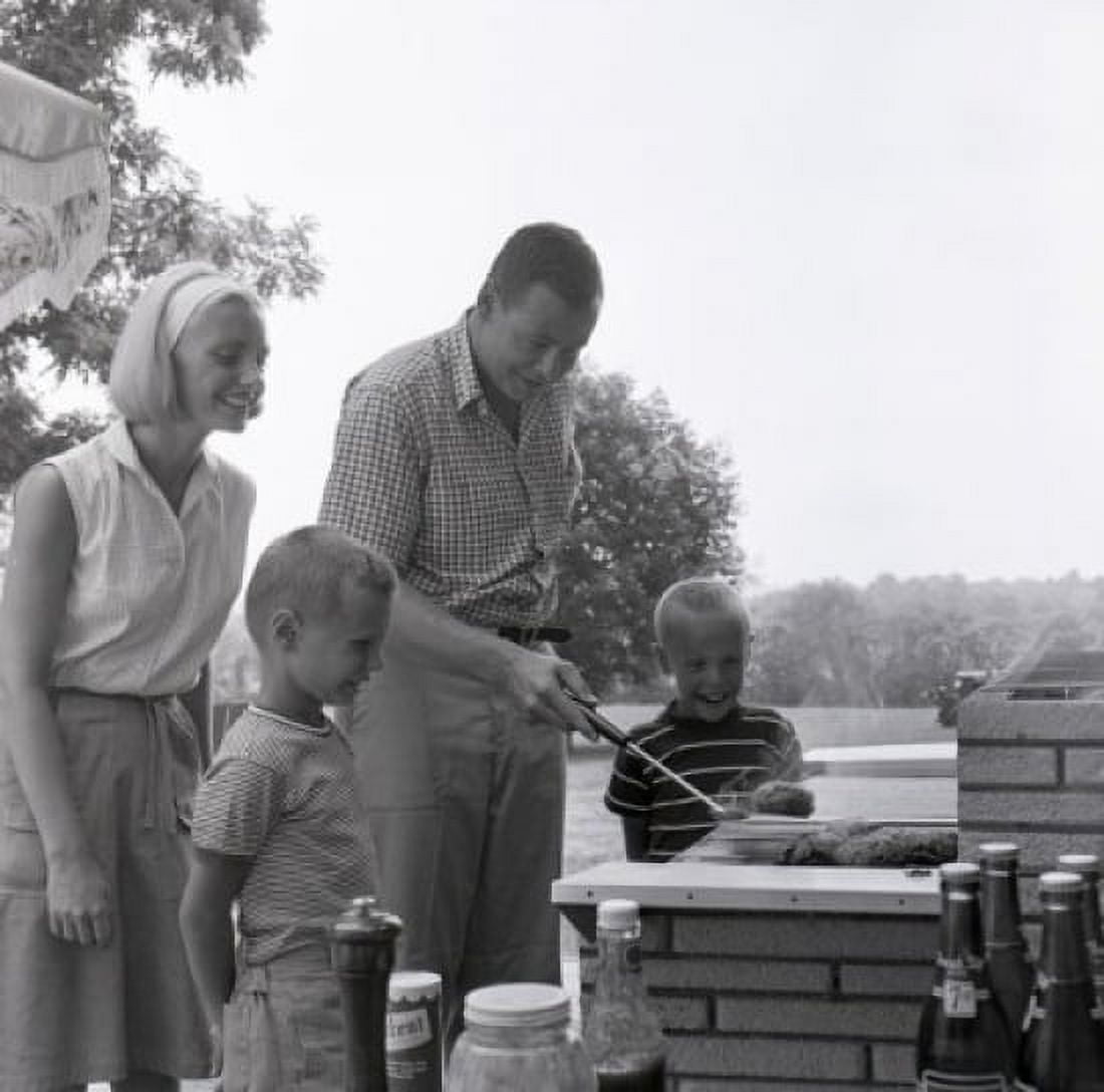 Family with two sons having barbecue Canvas Art - (18 x 24)