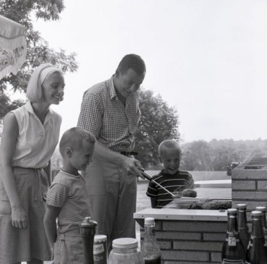 Family with two sons having barbecue Canvas Art - (24 x 36)