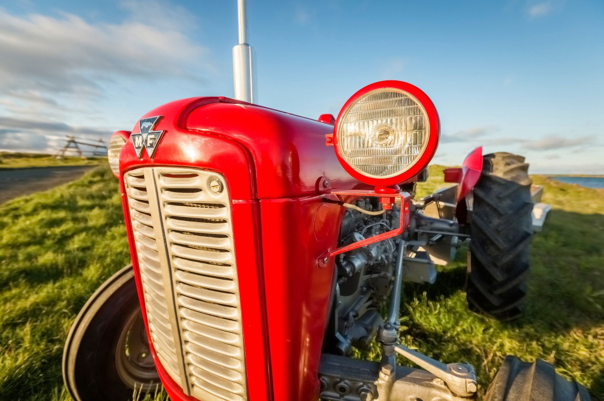 Farm tractor Flatey Island Borgarfjordur Iceland Canvas Art - Panoramic Images (9 x 27)