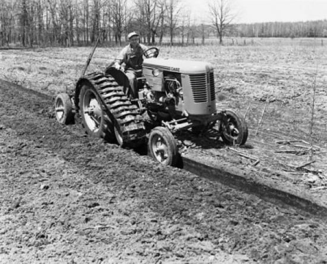 Farmer plowing a field with a tractor Canvas Art - (18 x 24)